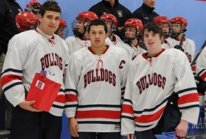 Left to right are seniors Chris Carchedi, Owen Lund and Chris Tanner. The hockey team's senior night was truly a momentous occasion as the Dogs defeated previously unbeaten Abington in an exciting game by a score of 2-1.
