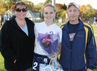 Taylor Lambrinos and her mom and dad, Erin and Scott.