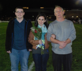 Nicole Cook was escorted by her brother John and her father Lewis.