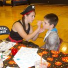 Kylie McKenna painting a face for Halloween