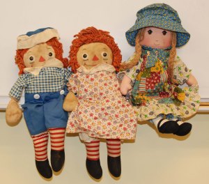 Ms. Cahill's Raggedy Ann and Andy dolls along with her Holly Hobby doll