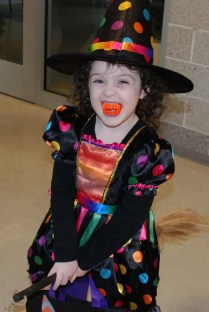 Little girl dressed as a witch