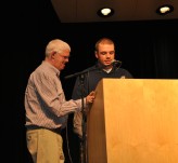 Mike McPeck reads the dedication of the yearbook to Jim Cahill